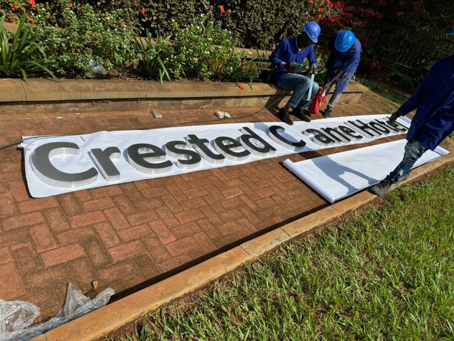 Crested Crane Hotel — channel letter assembly on site