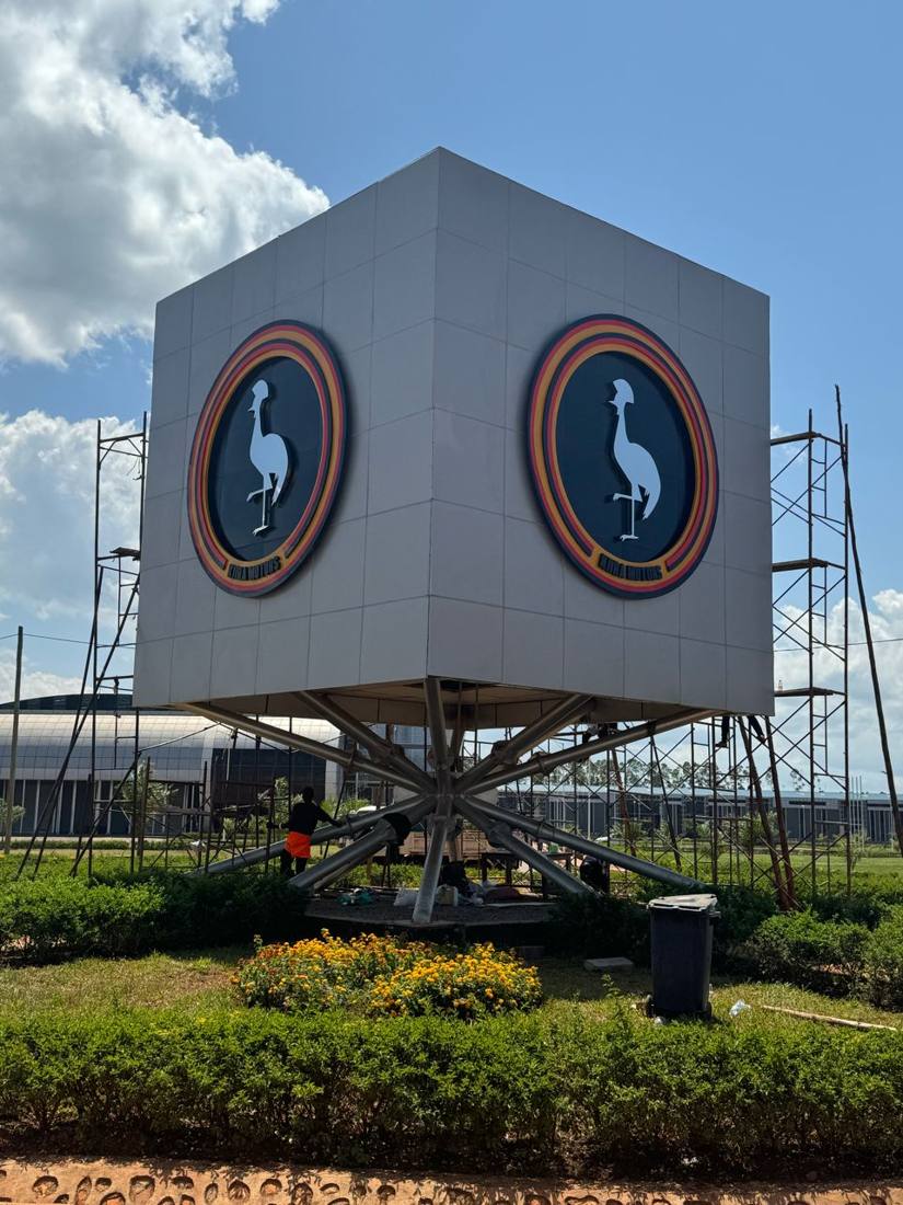 Kira Motors — crested crane cube signage