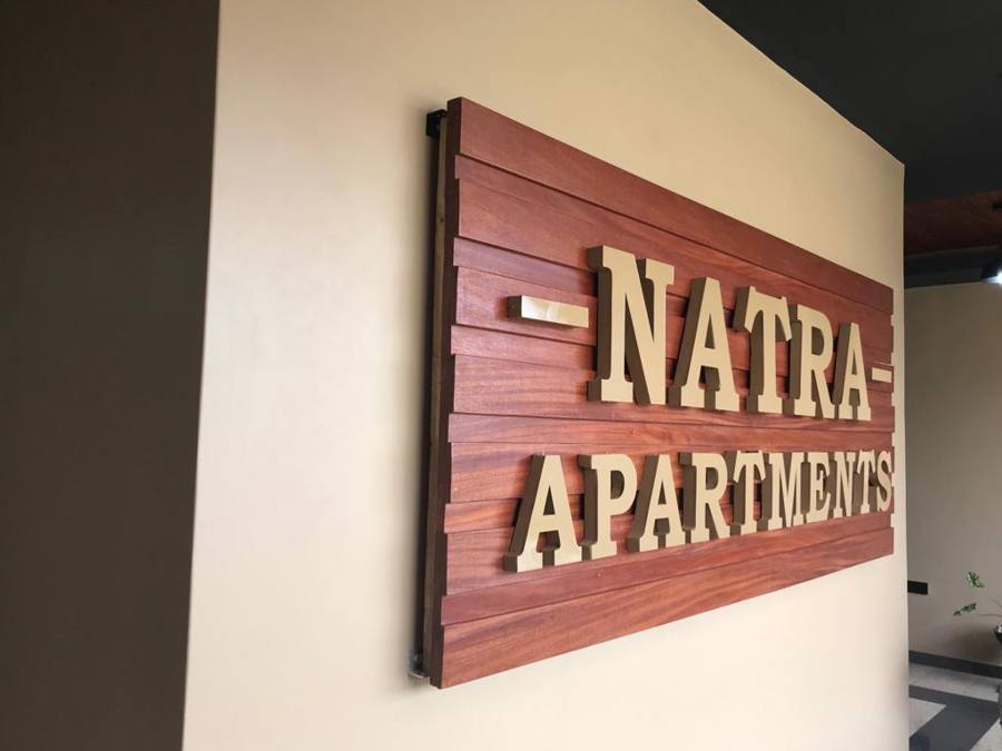 Natra Apartments — timber-mounted 3D letters