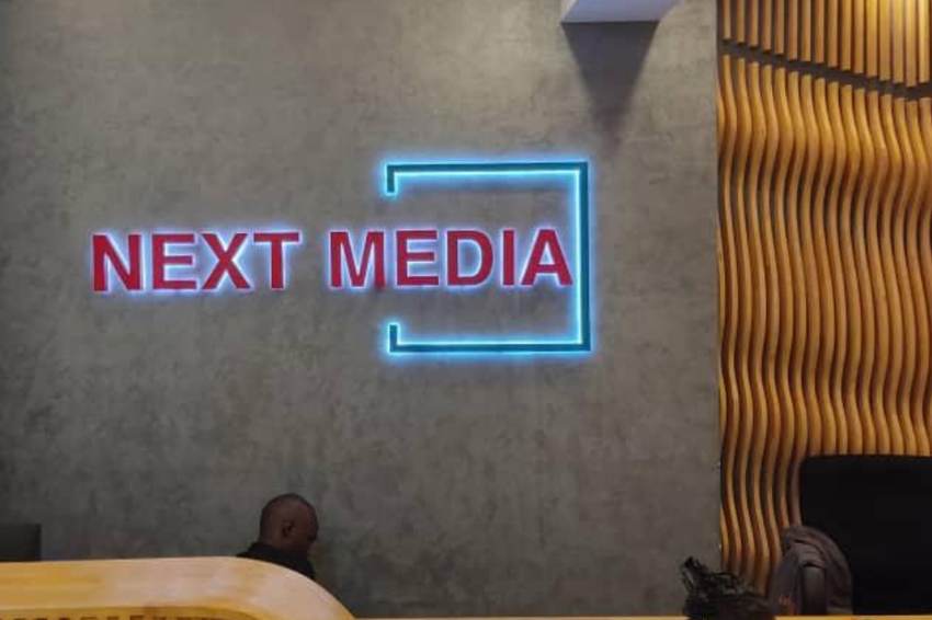 Next Media — illuminated reception sign