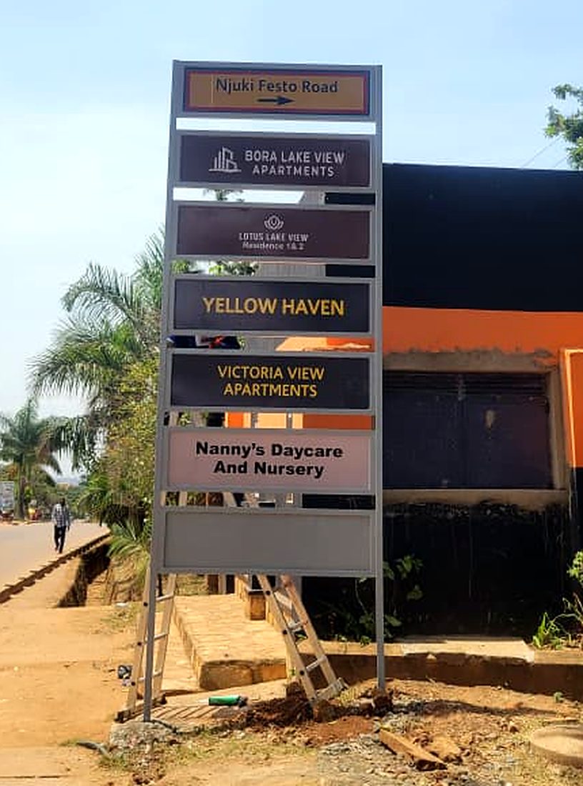 Njuki Festo Road — multi-tenant directory sign