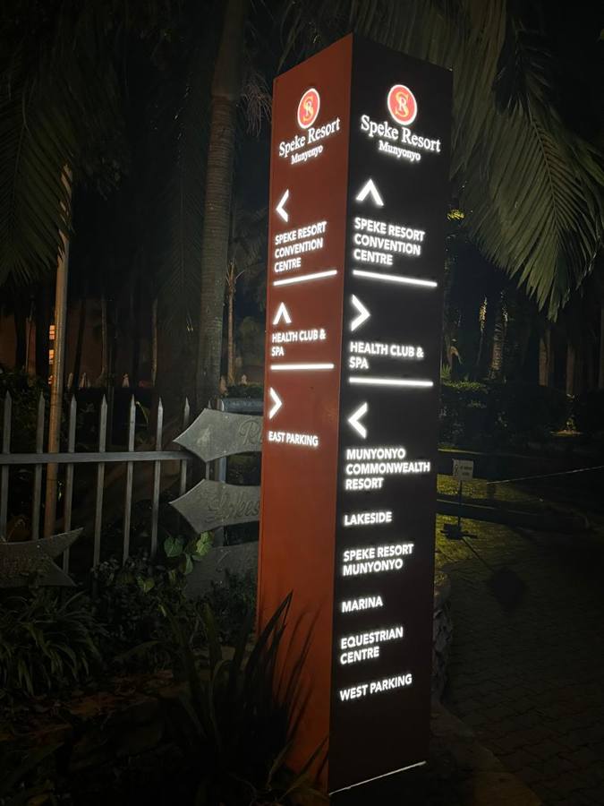 Speke Resort Munyonyo — illuminated directional pylon